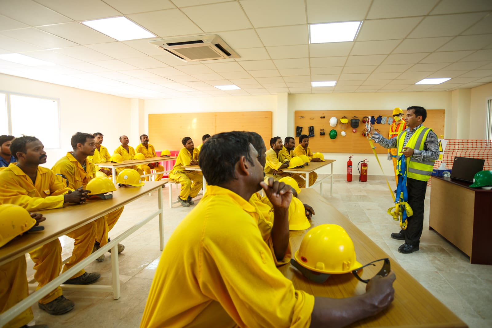 A safety briefing in the training hall, before the shift goes out